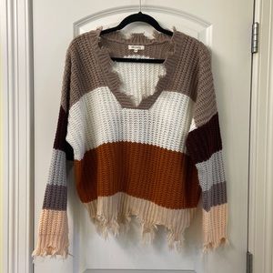 Miracle Sweater v neck frayed edges.